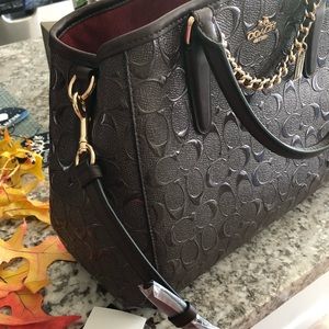 Brand new Oxblood maroon Coach purse with tags.